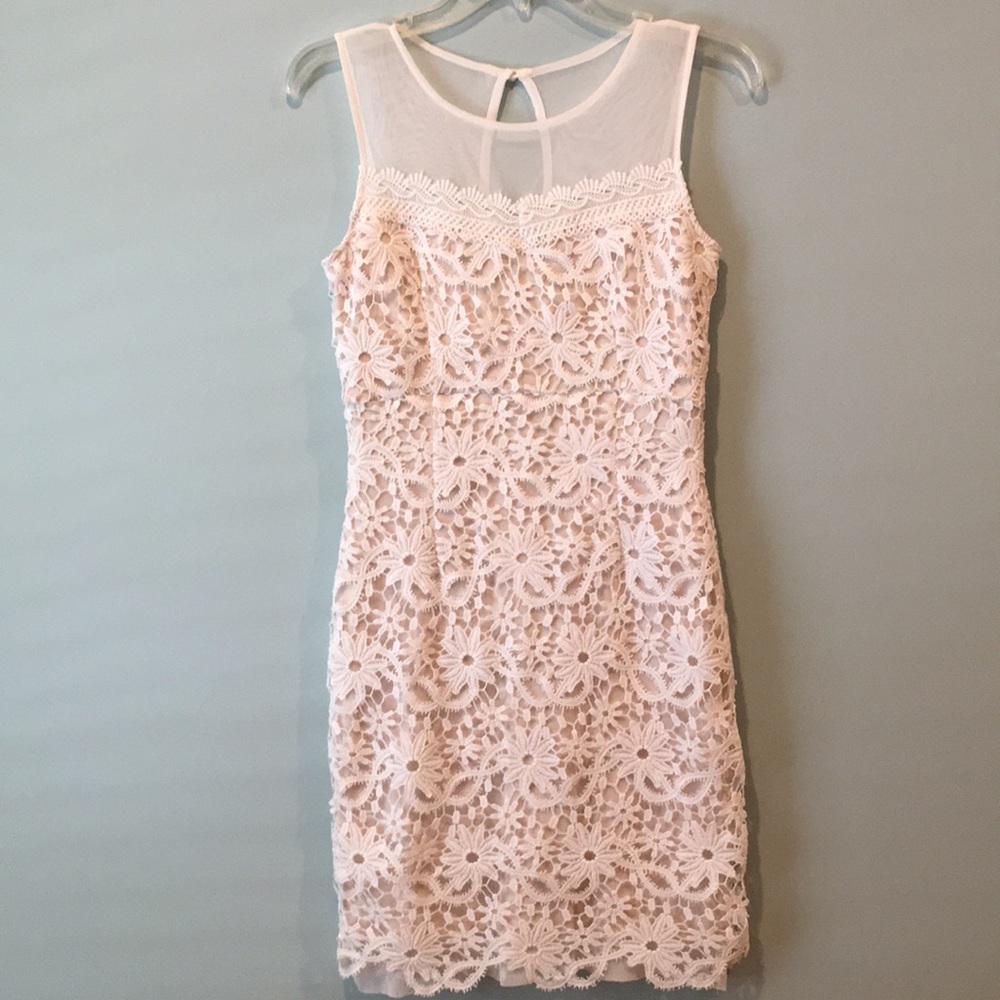 Sleeveless white lace dress with mesh top